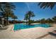 Enjoy a refreshing swim in this community pool surrounded by tropical palm trees at 17291 Saw Palmetto Ave, Clermont, FL 34714