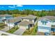 Charming two-story home with a paved driveway and lush, landscaped front yard at 17291 Saw Palmetto Ave, Clermont, FL 34714