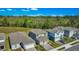 Lovely street view of single-Gathering homes boasts manicured lawns and tree backdrop at 17291 Saw Palmetto Ave, Clermont, FL 34714