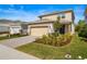 Charming two-story home with a well-manicured lawn and inviting front facade at 17291 Saw Palmetto Ave, Clermont, FL 34714
