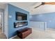 Cozy loft with mounted TV and modern electric fireplace at 17291 Saw Palmetto Ave, Clermont, FL 34714