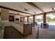 An outdoor kitchen includes granite countertops, stainless steel appliances, and ample seating at 17291 Saw Palmetto Ave, Clermont, FL 34714