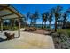 A serene picnic area boasts scenic lake views, shaded seating, and well-maintained landscaping at 17291 Saw Palmetto Ave, Clermont, FL 34714