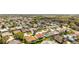 A high angle view captures a quiet residential neighborhood with mature trees and landscaping at 17416 Se 71St Currituck Ter, The Villages, FL 32162