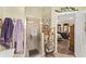 The bathroom showcases a glass-enclosed shower and decorative shelving at 17416 Se 71St Currituck Ter, The Villages, FL 32162