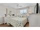Serene bedroom with a white dresser and a large window at 17416 Se 71St Currituck Ter, The Villages, FL 32162