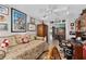 View of a charming room that features a daybed and a desk with a view of the dining room at 17416 Se 71St Currituck Ter, The Villages, FL 32162