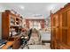 A cozy room with decorative wood features offering both a bedroom and office space at 17416 Se 71St Currituck Ter, The Villages, FL 32162
