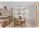 Cozy breakfast nook with a glass top table and bright floral curtains at 17416 Se 71St Currituck Ter, The Villages, FL 32162