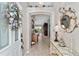 Welcoming foyer with stylish decor, arched doorway, and elegant furnishings setting a sophisticated tone at 17416 Se 71St Currituck Ter, The Villages, FL 32162