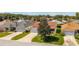Charming single-story home featuring well-manicured lawn, mature tree, and two-car garage at 17416 Se 71St Currituck Ter, The Villages, FL 32162