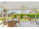 Relaxing screened lanai offering ample seating to enjoy an outdoor view and fresh air at 17416 Se 71St Currituck Ter, The Villages, FL 32162