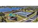 Enjoy community amenities with tennis courts, playground, and lake access at 17421 Woodfair Dr, Clermont, FL 34711
