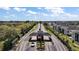 Gated community entrance with meticulously landscaped median and decorative architecture providing security and curb appeal at 17421 Woodfair Dr, Clermont, FL 34711