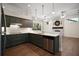 Beautiful kitchen with stainless steel appliances and a view into the living room at 17421 Woodfair Dr, Clermont, FL 34711