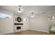 Spacious living room with a brick fireplace, wood floors, and ample natural light at 17421 Woodfair Dr, Clermont, FL 34711
