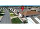 Aerial view showcases roof, landscaping, and proximity to other homes at 1805 Endsley Ct, The Villages, FL 32162
