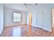 Bedroom offers wood floors, ample natural light and a vaulted ceiling at 1805 Endsley Ct, The Villages, FL 32162