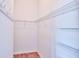 Walk-in closet with built in wire shelving and hanging hooks at 1805 Endsley Ct, The Villages, FL 32162