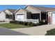 Inviting home exterior with a white picket fence and meticulously maintained landscaping at 1805 Endsley Ct, The Villages, FL 32162