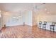 Bright and airy living space featuring laminate flooring, high ceilings, and a breakfast bar at 1805 Endsley Ct, The Villages, FL 32162