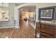 Inviting living room with wood floors, neutral walls, and an open floor plan is great for entertaining at 1970 Farmington Ct, Clermont, FL 34711