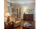 Inviting living room showcasing hardwood floors, a comfy chair, and decorative accents at 1970 Farmington Ct, Clermont, FL 34711