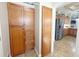 Built in wooden pantry including cabinets and drawers visible from the kitchen area at 1970 Farmington Ct, Clermont, FL 34711