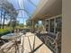 Inviting screened-in patio with comfortable seating and views at 1970 Farmington Ct, Clermont, FL 34711