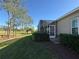 View of the screened porch and golf course, seamlessly blending indoor and outdoor living at 1970 Farmington Ct, Clermont, FL 34711