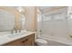 Bathroom featuring a new vanity, updated lighting, and a combination tub and shower at 20740 Queen Alexandra Dr, Leesburg, FL 34748