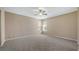 Spacious bedroom with carpeted floors, ceiling fan, recessed lighting, and natural light at 20740 Queen Alexandra Dr, Leesburg, FL 34748