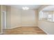 Dining Room with hardwood floors, a modern light fixture, and natural light at 20740 Queen Alexandra Dr, Leesburg, FL 34748