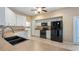 Bright kitchen with black appliances, light countertops, tiled floors, and a stainless steel sink at 20740 Queen Alexandra Dr, Leesburg, FL 34748