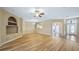 Open living space with hardwood floors, dining area, and front entrance view at 20740 Queen Alexandra Dr, Leesburg, FL 34748