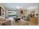 Open-concept living area with dining space and sliding glass door to patio at 20740 Queen Alexandra Dr, Leesburg, FL 34748