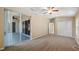 Spacious main bedroom with an adjoining sunroom, plush carpets, and a neutral color palette at 20740 Queen Alexandra Dr, Leesburg, FL 34748