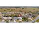 Aerial view of a quiet neighborhood, showcasing well-maintained homes and green surroundings at 20740 Queen Alexandra Dr, Leesburg, FL 34748