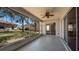 Screened lanai with ceiling fan, views of back yard, and access to home at 20740 Queen Alexandra Dr, Leesburg, FL 34748