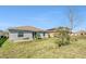 Expansive backyard features lush green grass and an open patio, perfect for outdoor enjoyment at 212 Taft Dr, Davenport, FL 33837