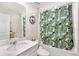 Bathroom features a single sink vanity and shower with a curtain with leaf design at 212 Taft Dr, Davenport, FL 33837