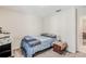 Bedroom features carpeted floors and a bed with patterned bedding at 212 Taft Dr, Davenport, FL 33837