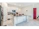 Bright kitchen with stainless steel appliances, center island, and ample counter space at 212 Taft Dr, Davenport, FL 33837