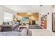 Comfortable living room featuring gray sofas, geometric accent wall and a view into the kitchen at 212 Taft Dr, Davenport, FL 33837