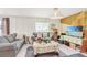 Comfortable living room showcasing cozy gray sofas, pendant lighting, and a view of the room's layout at 212 Taft Dr, Davenport, FL 33837