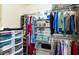 Walk-in closet with shelving and ample storage space for clothing and accessories at 2225 Cypress Ct # 2C, Tavares, FL 32778