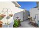 Enclosed courtyard with elegant furniture, vibrant flowers, and decorative plants at 2225 Cypress Ct # 2C, Tavares, FL 32778