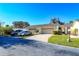 Well-maintained exterior with a paved driveway, two-car garage, and manicured lawn at 2225 Cypress Ct # 2C, Tavares, FL 32778