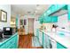 Spacious kitchen featuring white appliances, modern lighting, and ample counter space at 2225 Cypress Ct # 2C, Tavares, FL 32778