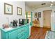 View of a kitchenette with teal cabinets and a coffee station at 2225 Cypress Ct # 2C, Tavares, FL 32778